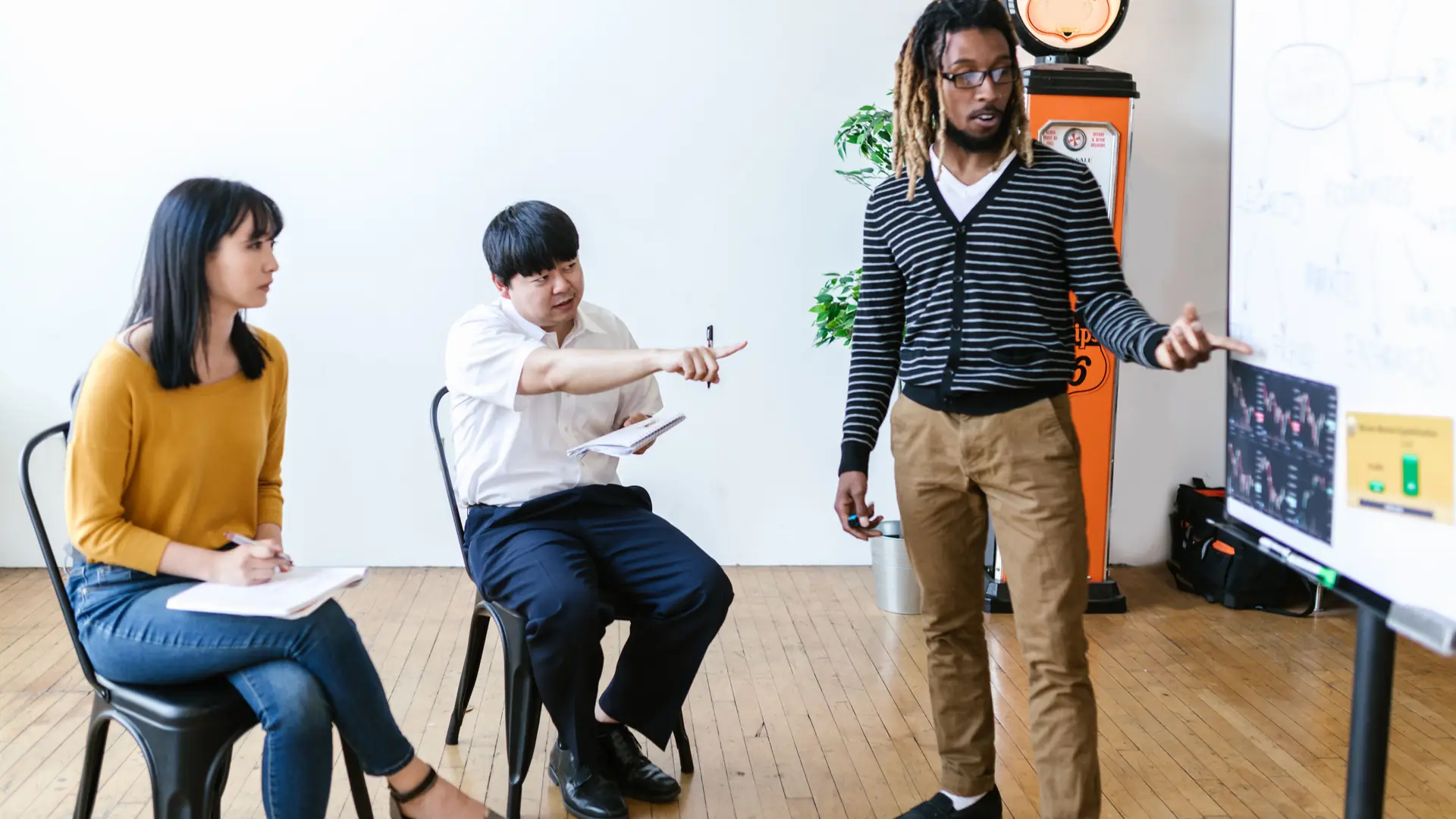 A trainer presenting to participants in a corporate training session
